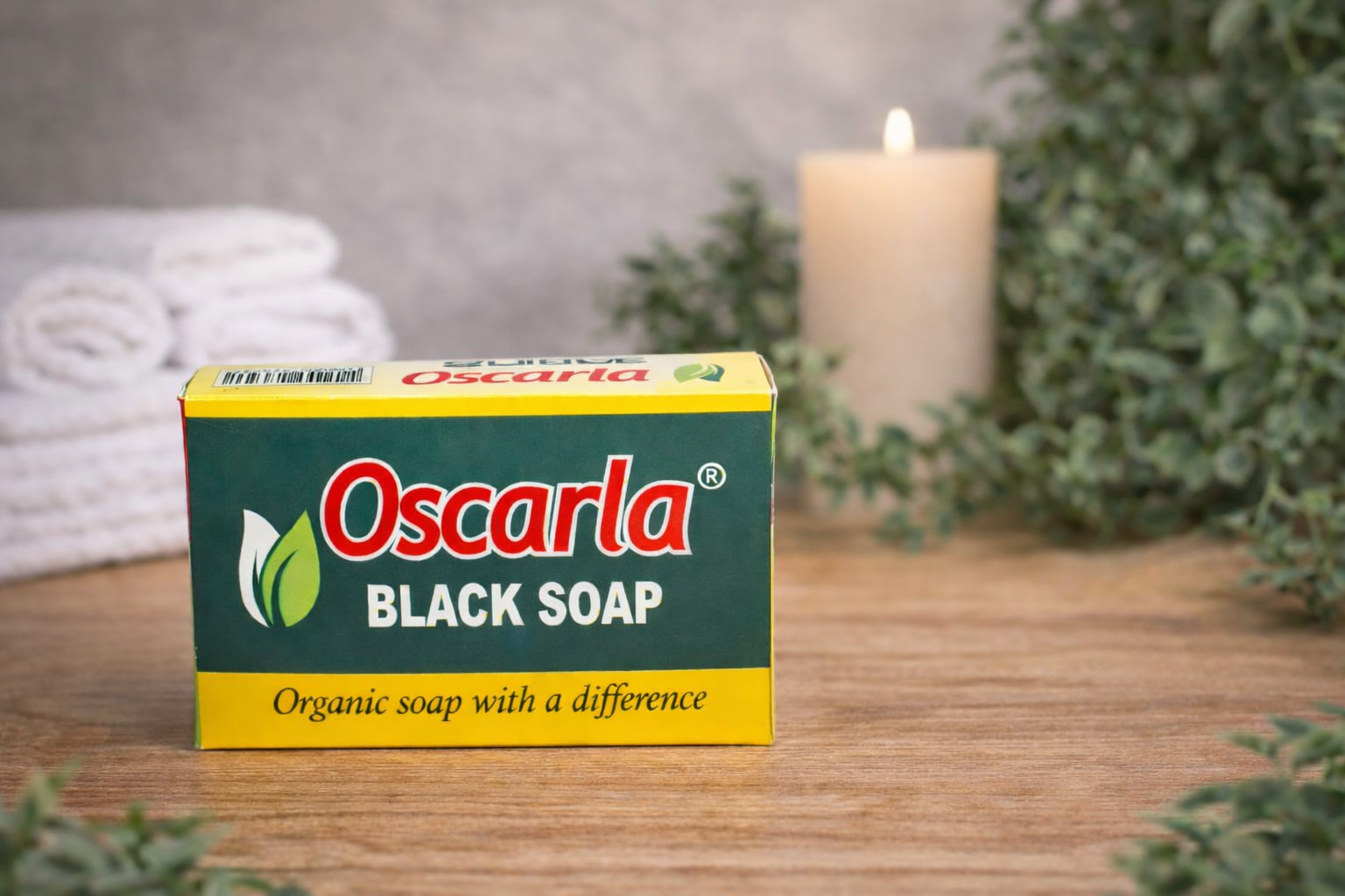 Oscarla Black Soap carton on a wooden surface