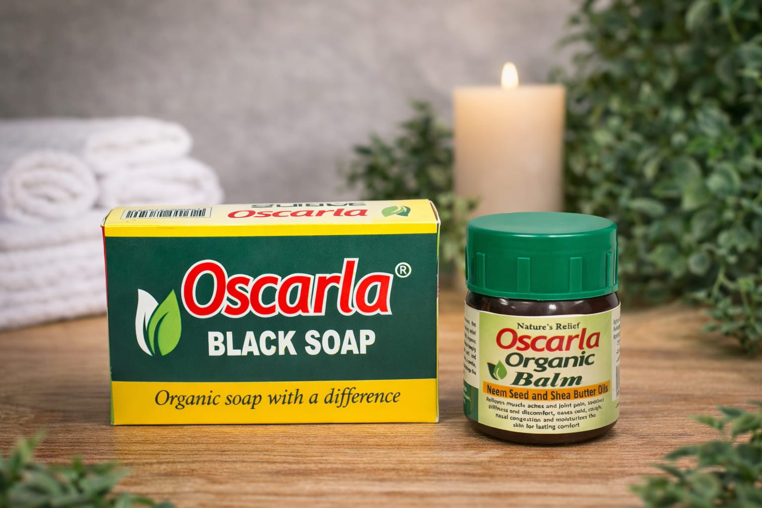 Oscarla Organic Balm and Oscarla Black Soap displayed together with natural greenery